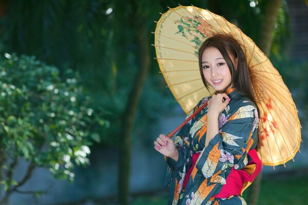 Lumineux fille asiatique avec parapluie