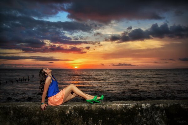 Girl on the sea evening sunset