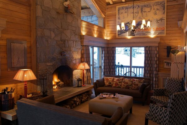 Warm light from the chandelier and lamps in the living room