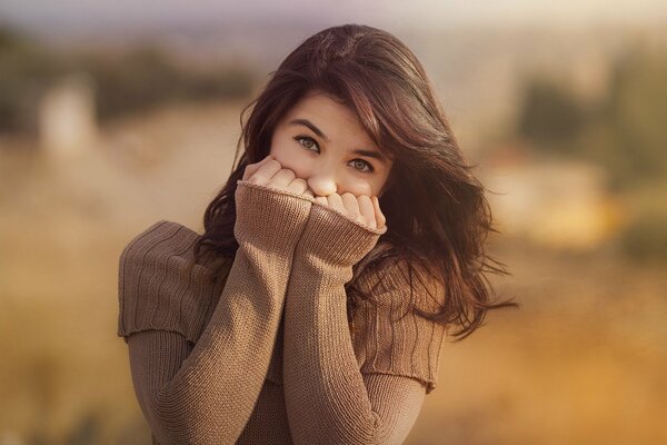 Portrait of a beautiful brunette in nature