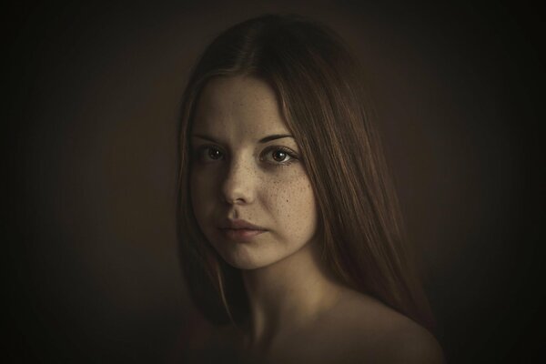 Photo of a brown-eyed girl with freckles