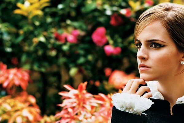 The look of beauty on a background of flowers