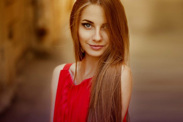 Portrait of a red-haired girl in red