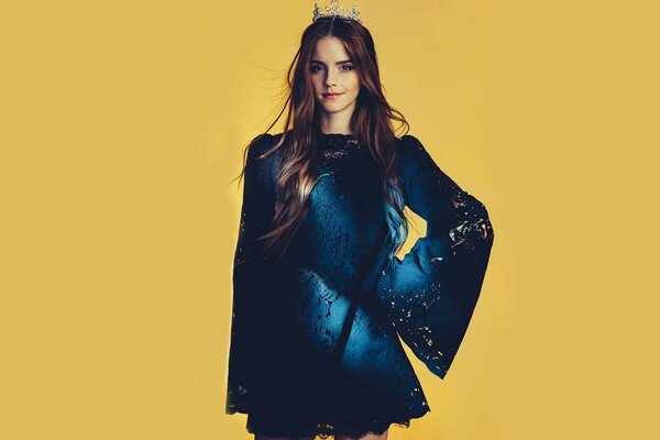 Emma Watson in a blue dress on a yellow background