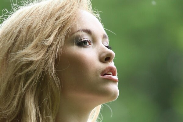 Close-up image of a blonde girl s face