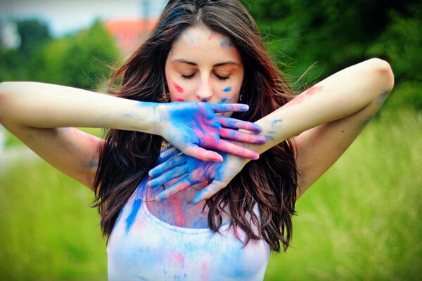 A girl with brightly colored hands