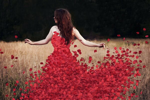 A girl in a dress made of red petals