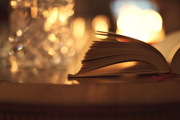 An open book on a blurry bokeh background