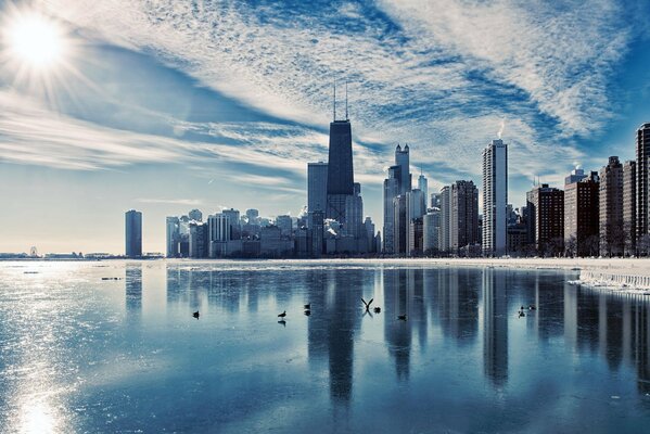 Illinois skyscrapers with reflection in the water against the background of the evening sky