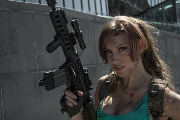 Lara croft with a machine gun in blood