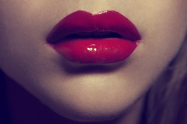 Red lipstick on juicy lips