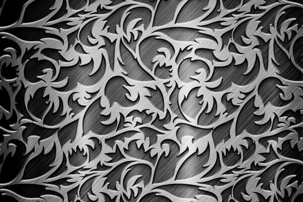 Silver patterns of curls and leaves