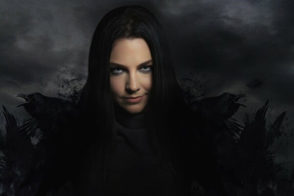 Amy Lee from the band Evanescence in black and with crows on her shoulders