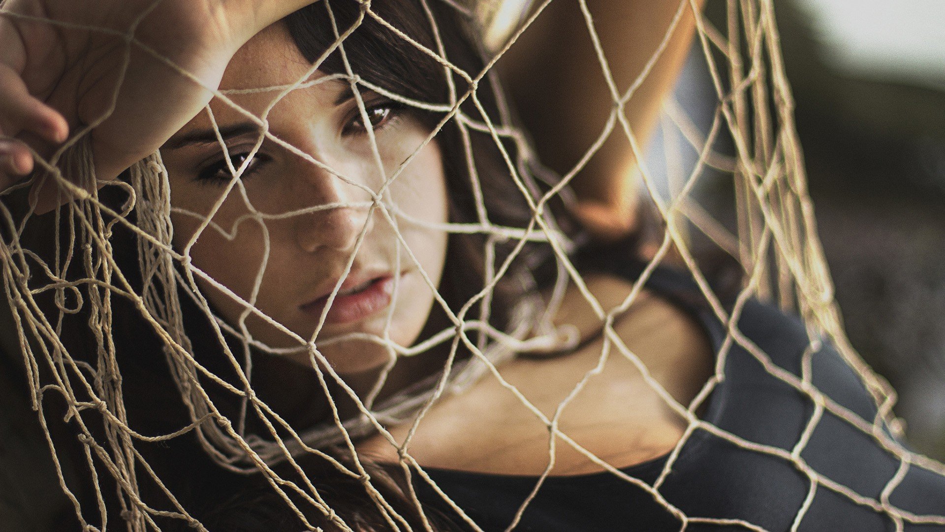 mood girl brunette net net rope look face hand fatigue. reflections background wallpaper wide-format