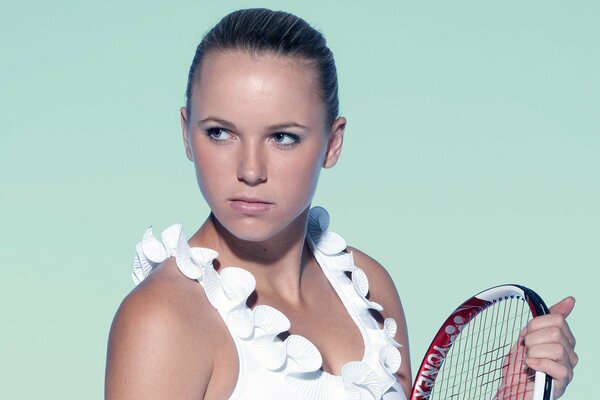 Tennessean with a racket on a green background