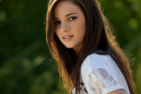 Beautiful girl in a white dress in the park