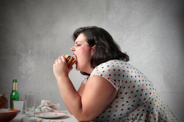 Fat girl eating a sandwich