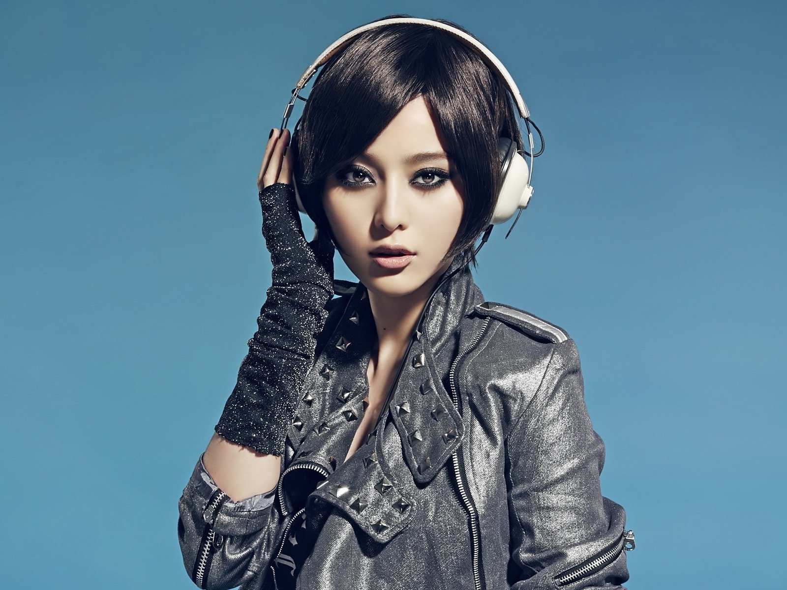 tyle girl asian view headphones blue background