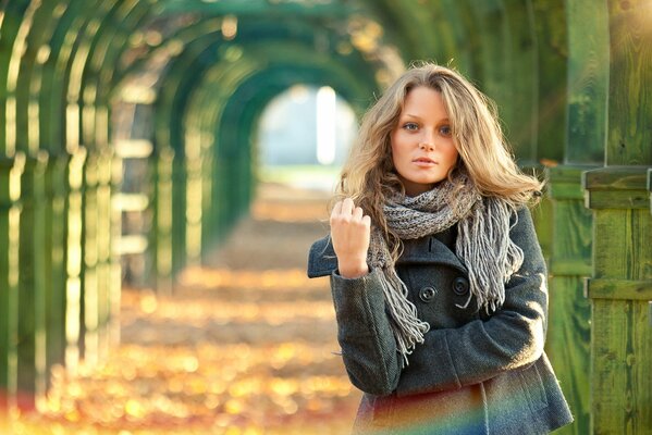 A beautiful girl next to the arches. Rainbow