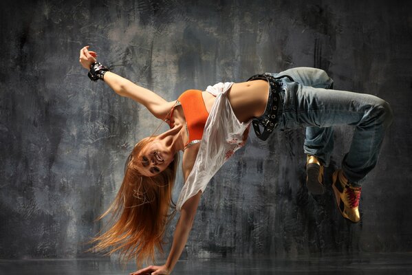 Girl dancing near wallpaper