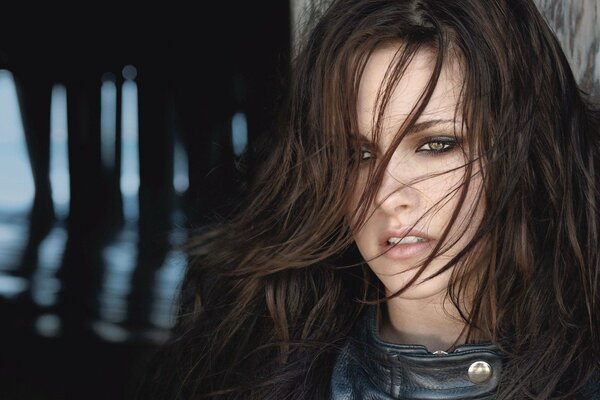 A charming brunette with a thoughtful look