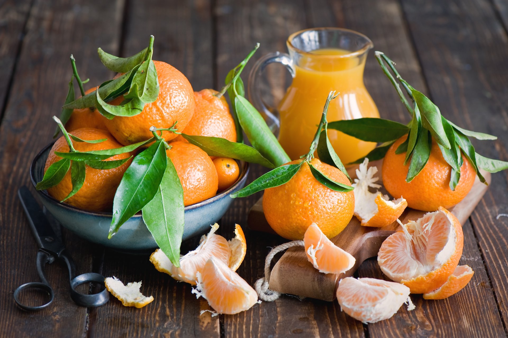 mandarins fruits citrus leaves peel segments juice pitcher carafe board scissors tableware anna verdina