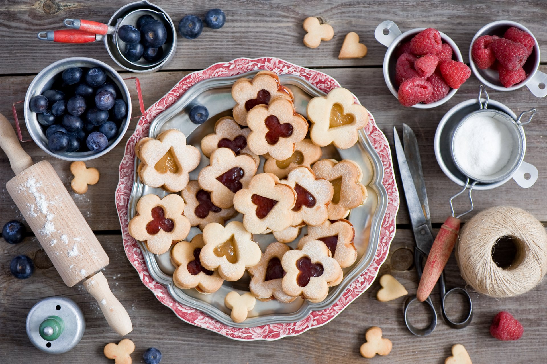 cookies berries blueberries raspberry scissors thread still life