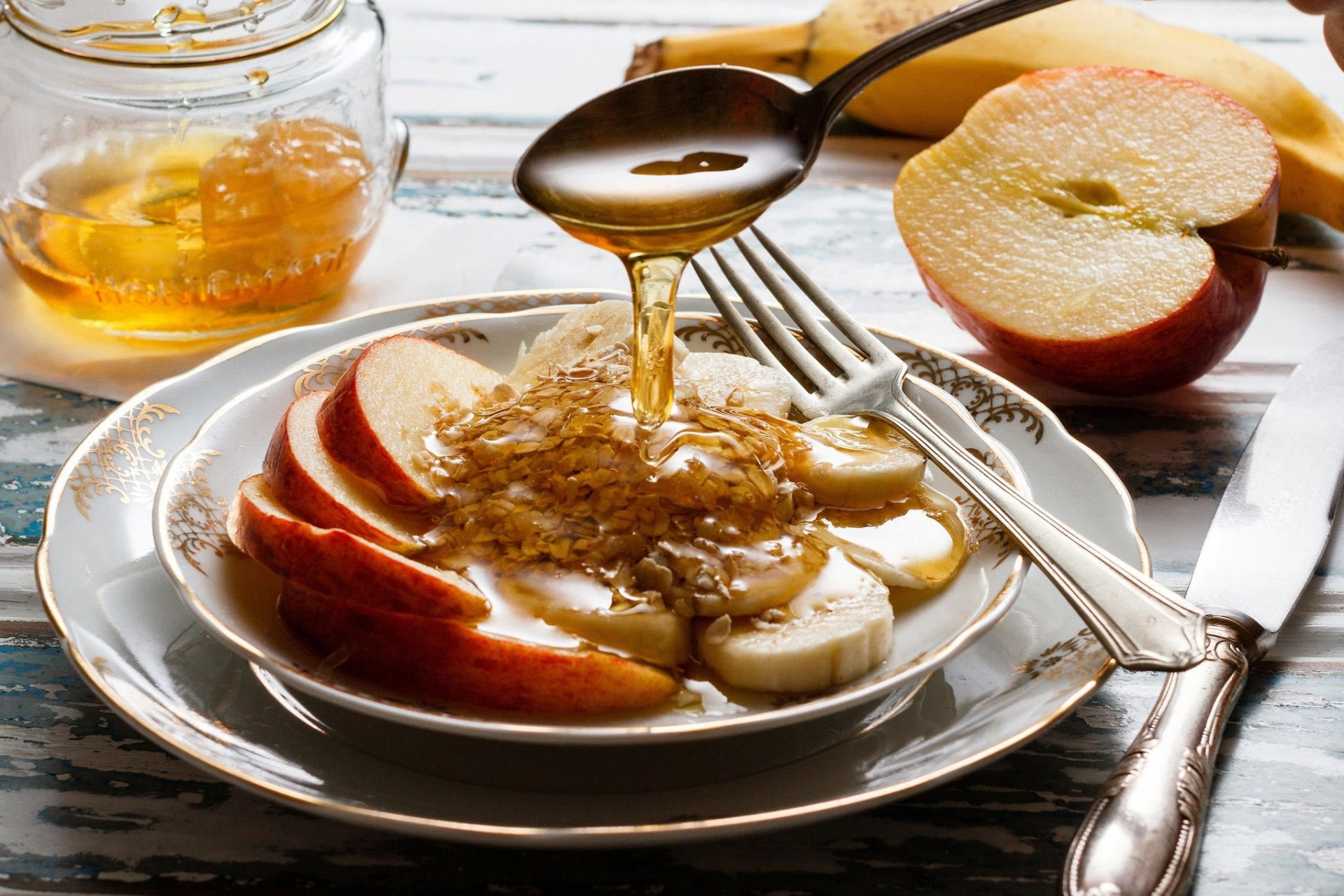 breakfast apples bananas honey cereals spoon fork knife dish