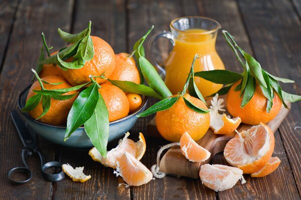 Tangerines and dishes on the table