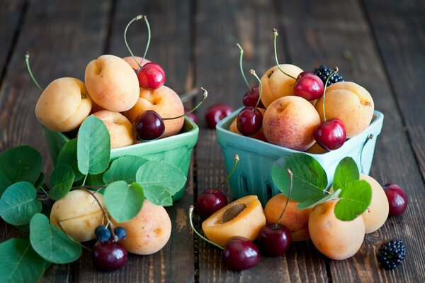 Bowls with cherries and apricots