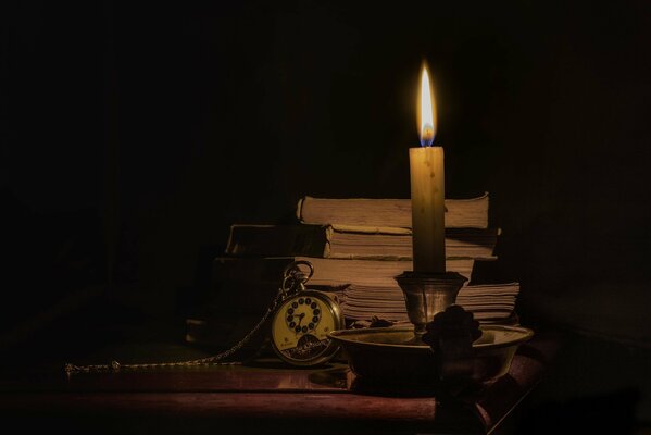 Still life with elements of books and candles