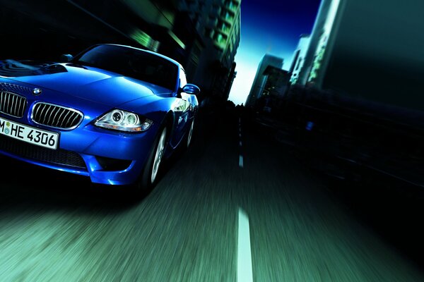 Blue BMW at speed