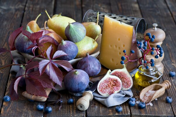 Still life figs, cheese, pears, berries