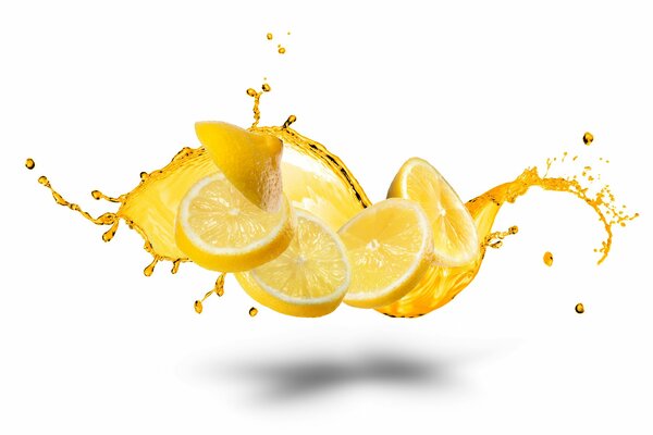 Lemon slices on the former background in splashes from them