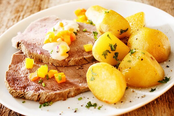 Delicious potatoes with baked meat
