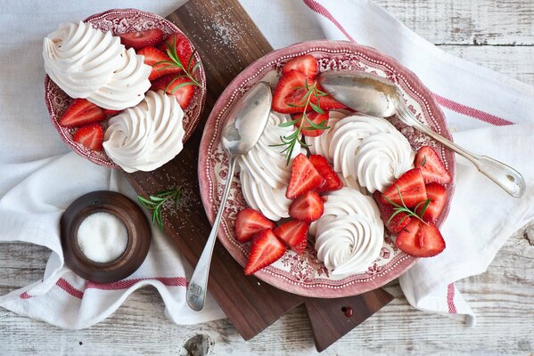 Aesthetic photo of meringue dessert with strawberries