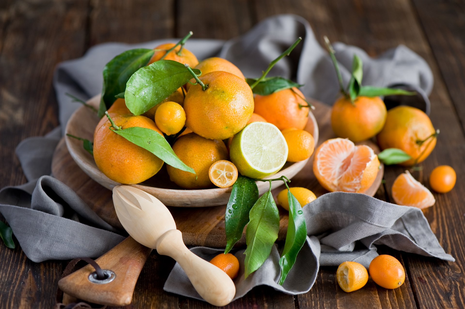 mandarins lima kumquat fruits orange citrus leaves drops board still life winter anna verdina