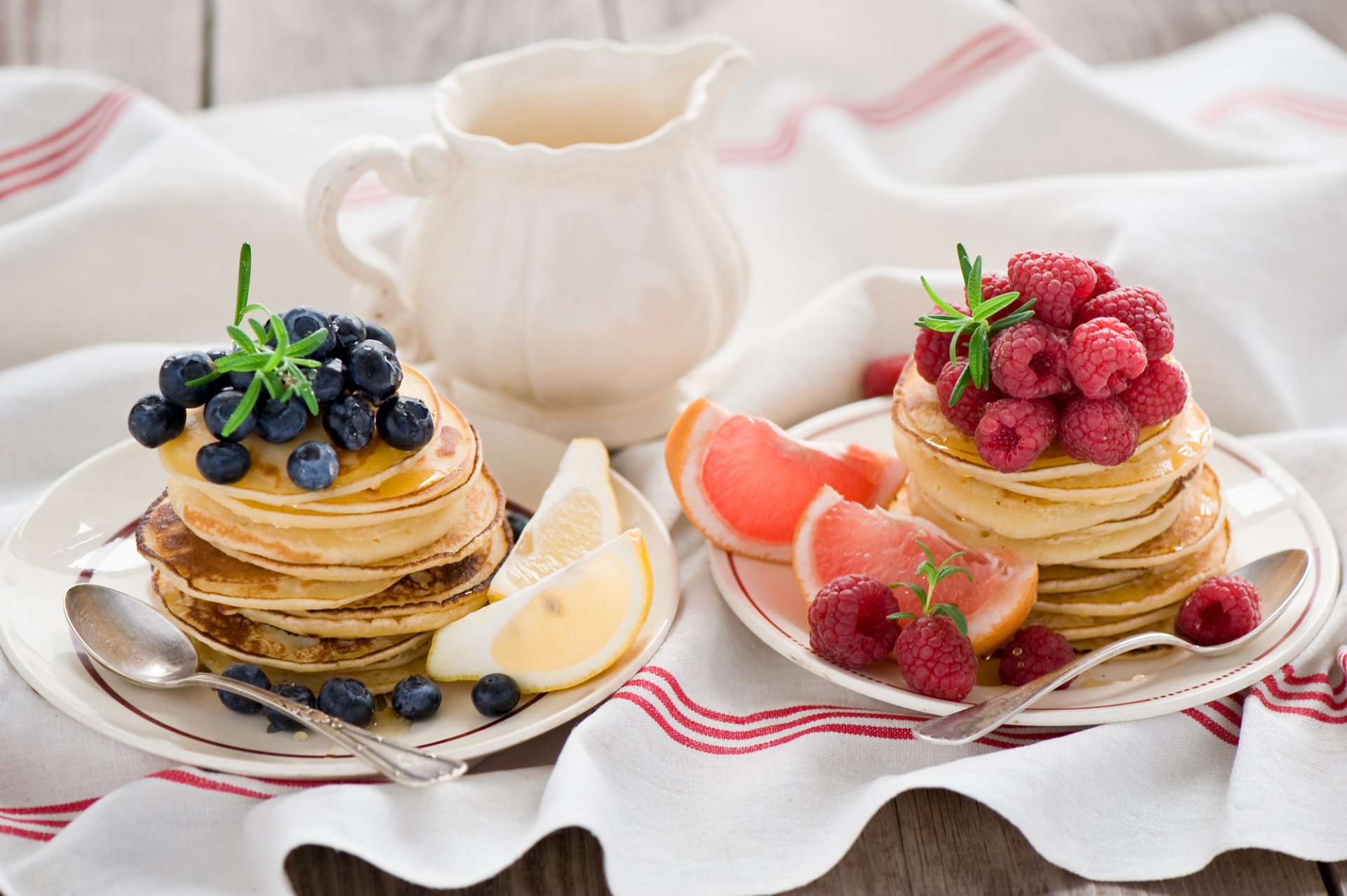 pancakes pancakes fruits berries blueberries raspberries grapefruit lemon citrus fruits plates spoons food anna verdina