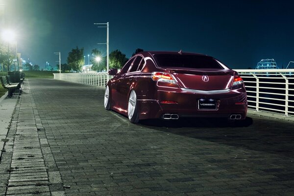 Car Akura on the embankment in the evening