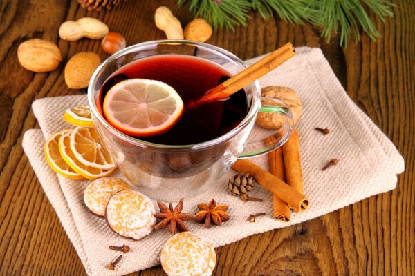 A drink with spices and cookies for the winter holiday