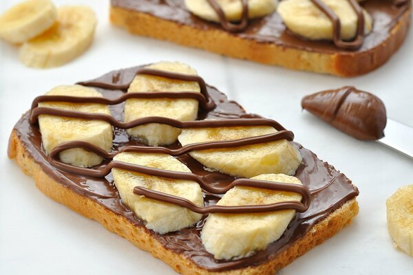 Bread sandwich with chocolate paste and bananas