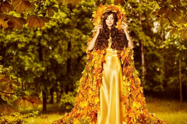 A girl on the background of an autumn landscape