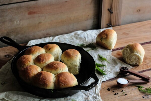 Fragrant pastries with herbs in a frying pan