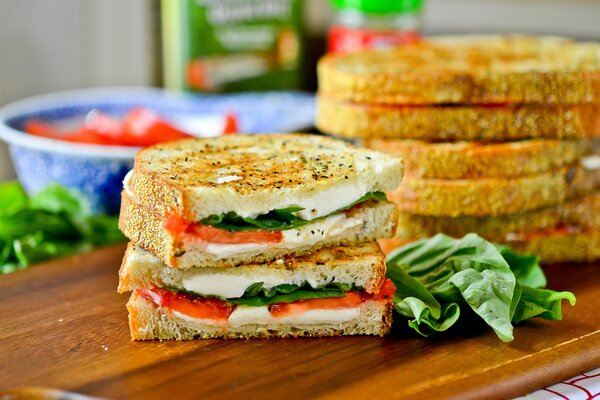 Layered sandwich with lettuce leaves and tomatoes