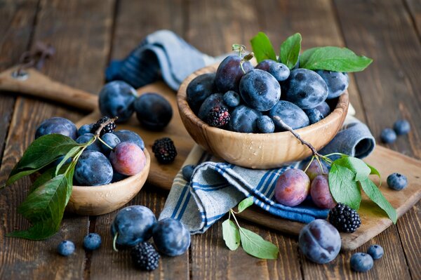 Plums blackberries blueberries board