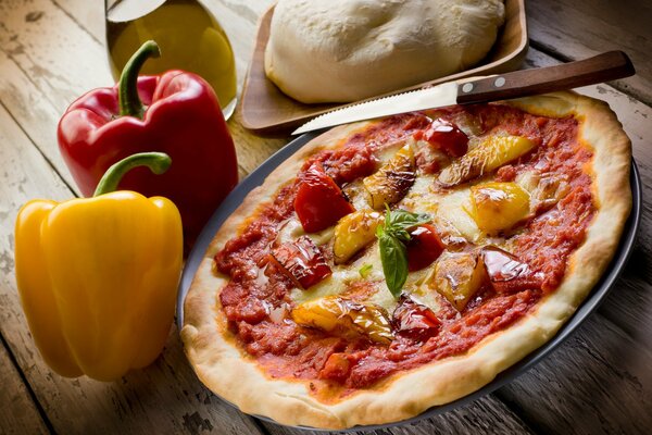 Italian pizza with vegetables on the table