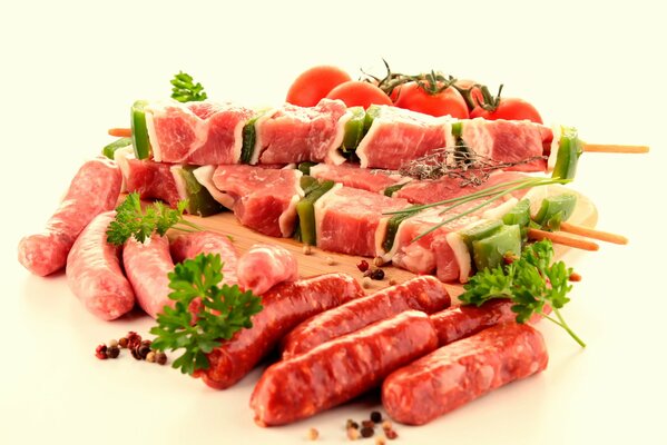 Meat products decorated with tomatoes and herbs