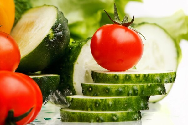 Slices of fresh cucumbers and tomatoes