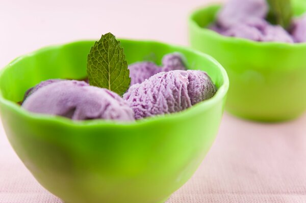 Ice cream with mint leaves in green cups