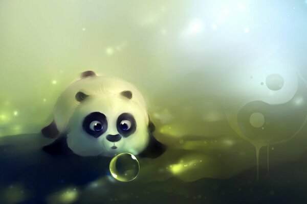 Panda - ein Teddybär, der auf dem Bauch liegt